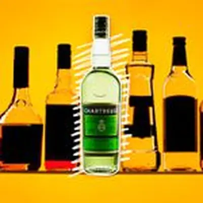 A bottle of Green Chartreuse is centered on an orange backdrop with white, squiggly lines behind it. Flanking the Chartreuse are other bottles, their labels darkened out