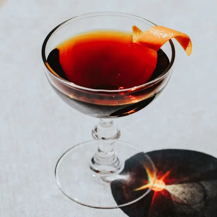 Hanky Panky cocktail in a coupe glass with an orange peel garnish