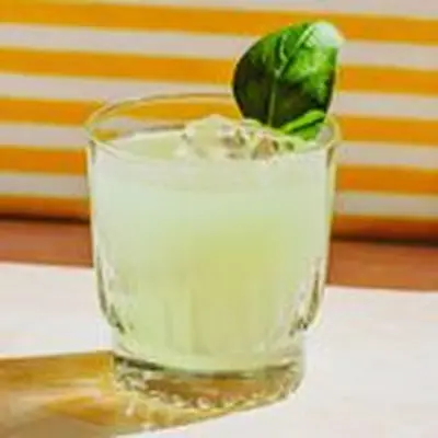 Cucumber Basil & Lime Gimlet with basil leaf garnish