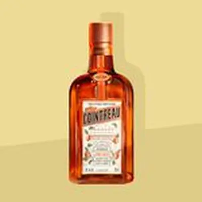Bottle of Cointreau solo on a yellow background