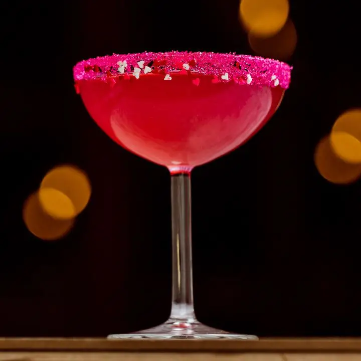 Bitter Hearts Know Better cocktail with pink sugared rim 
