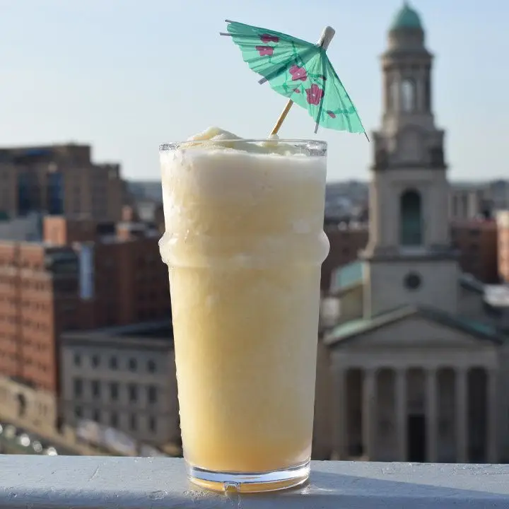 montego mule on a ledge, garnished with an umbrella