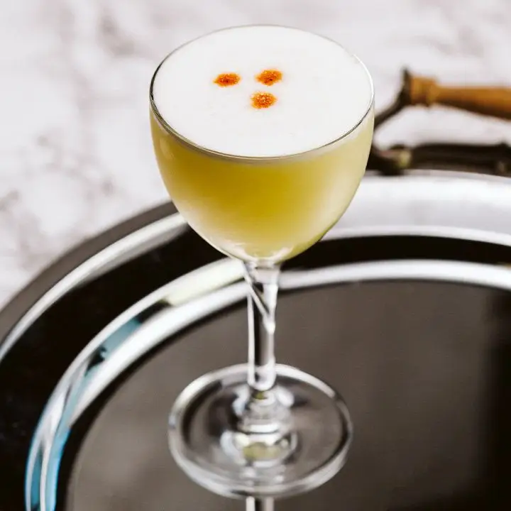 Pisco Sour cocktail garnished with Angostura bitters