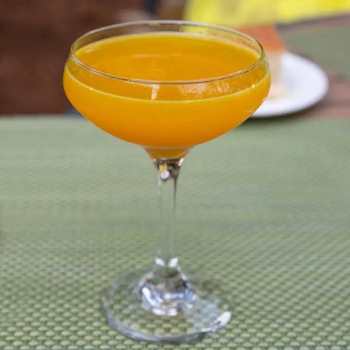 bright-orange always Sunny cocktail in a coupe glass