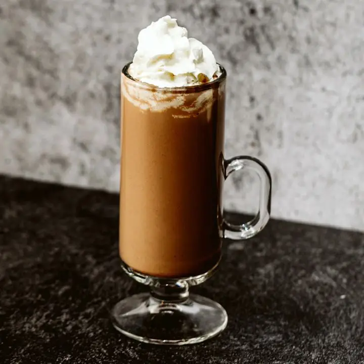 Rumplesnuggler cocktail in Irish Coffee mug topped with whipped cream