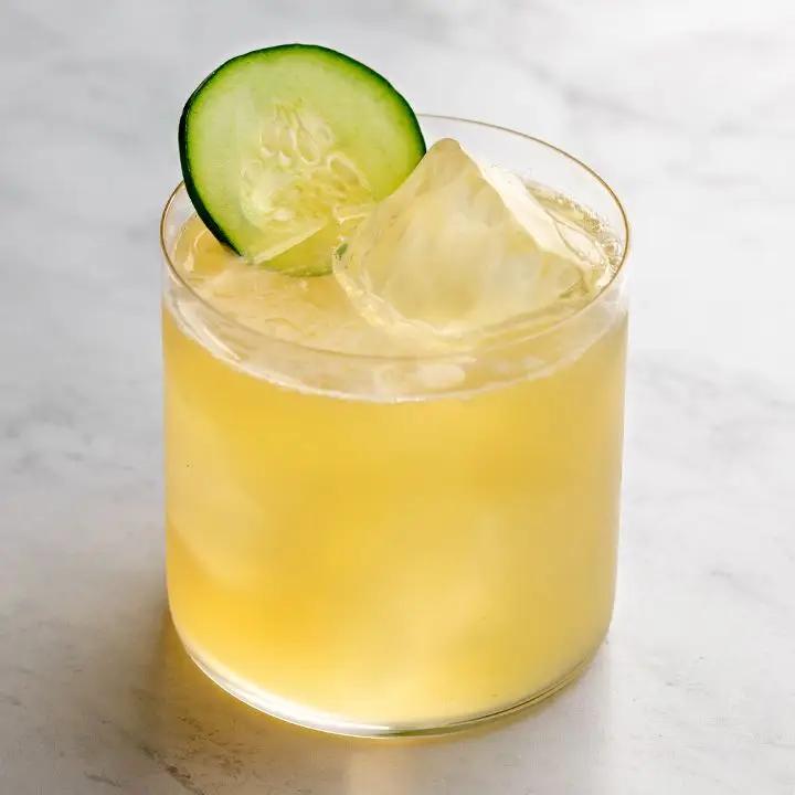 Irish Maid cocktail on the rocks with a cucumber garnish