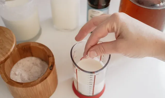 Adding a pinch of salt to make salted caramel sweet cream cold brew.' title='Sweet Cream Cold Foam Recipe