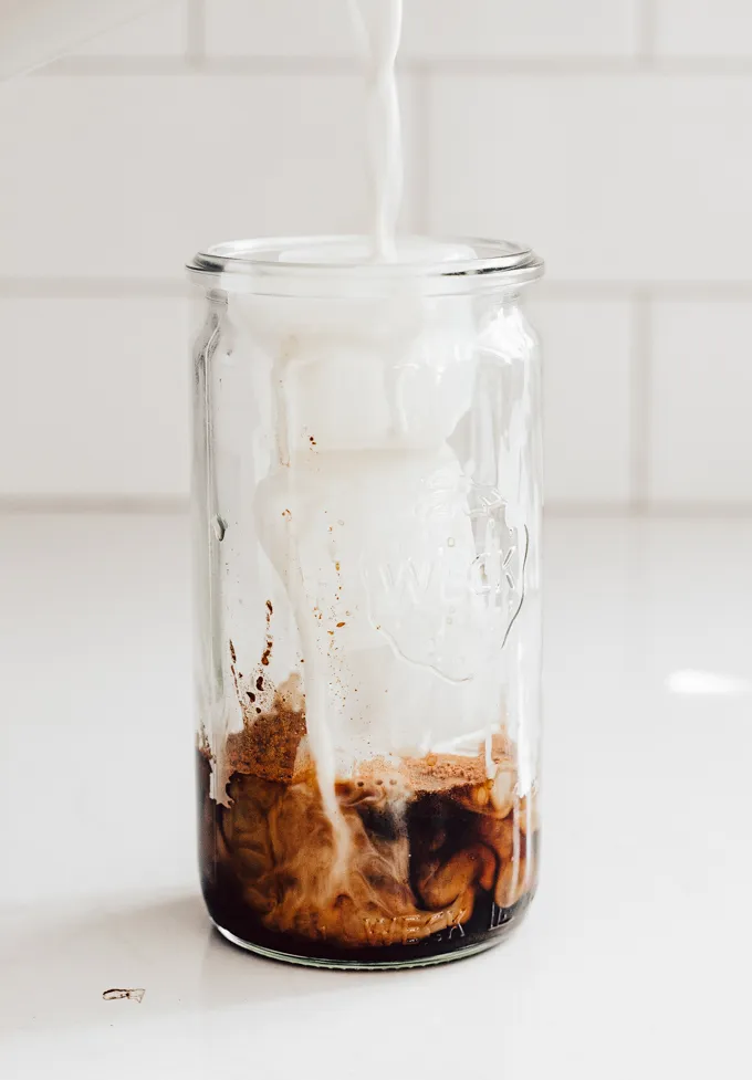 Pouring the oat milk on top.' title='Brown Sugar Oat Milk Shaken Espresso