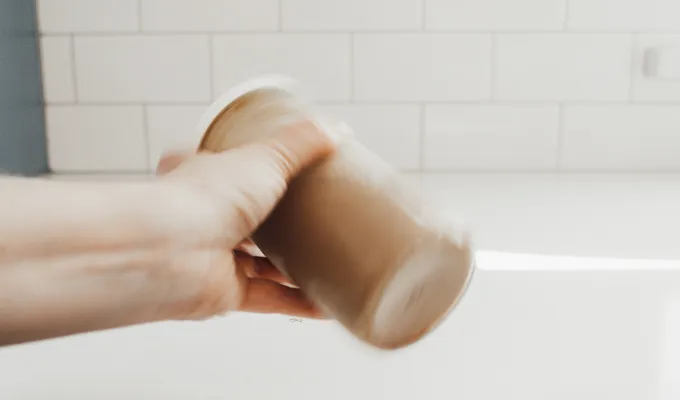 Shaking it up with a lid on top.' title='Brown Sugar Oat Milk Shaken Espresso