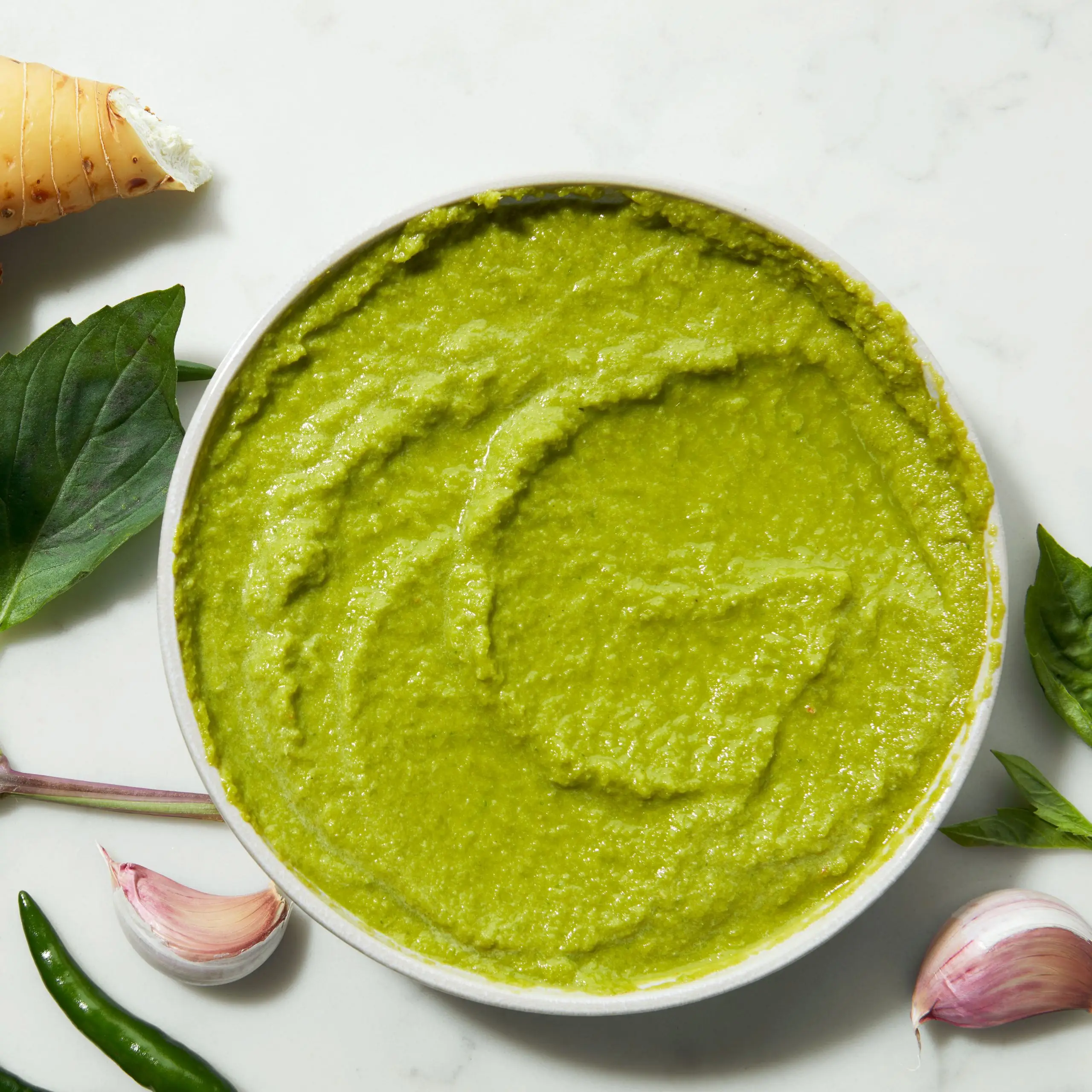 Photo of green curry paste in a bowl.