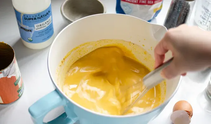 Whisking all of the ingredients together.' title='Easy Baked Pumpkin Custard with Nutmeg Whipped Cream