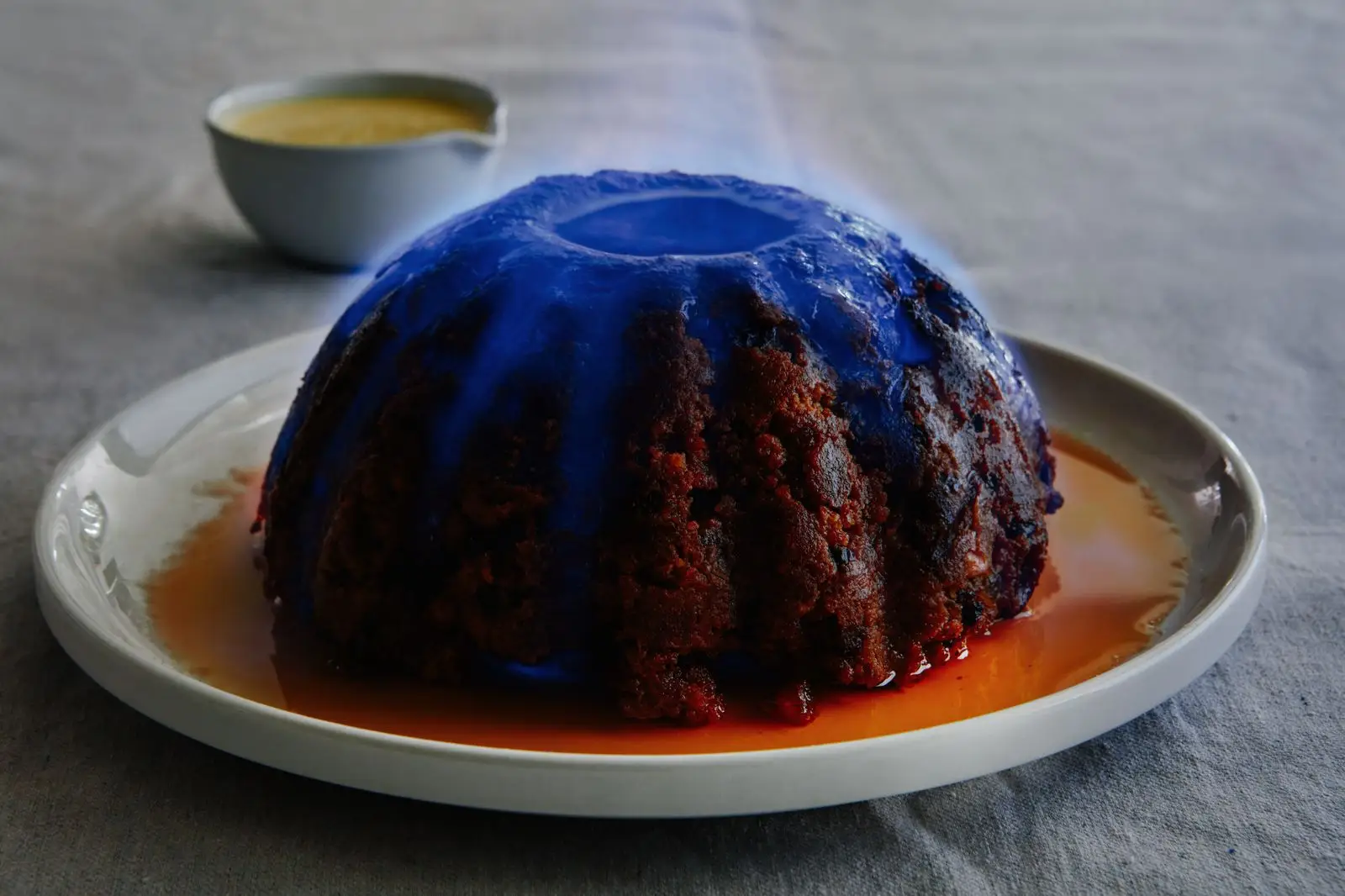 Plum Pudding on a platter lit on fire