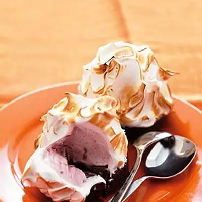 Image may contain Food Creme Dessert Cream Meal Cutlery Spoon Dish Confectionery and Sweets