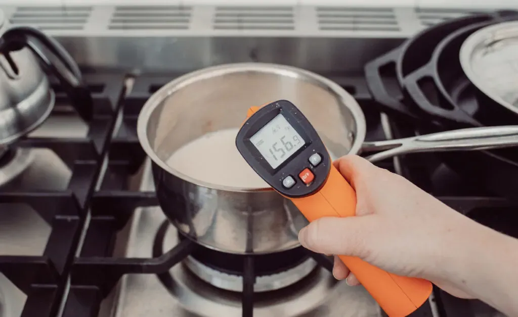 Heating the milk and cream in a pan and checking the temperature with a laser thermometer. ' title='Homemade London Fog Tea Latte (Earl Grey Latte)