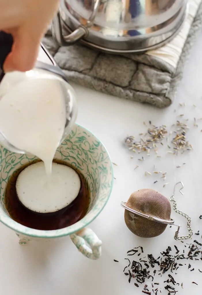 Heating the milk and cream in a pan and checking the temperature with a laser thermometer. ' title='Homemade London Fog Tea Latte (Earl Grey Latte)