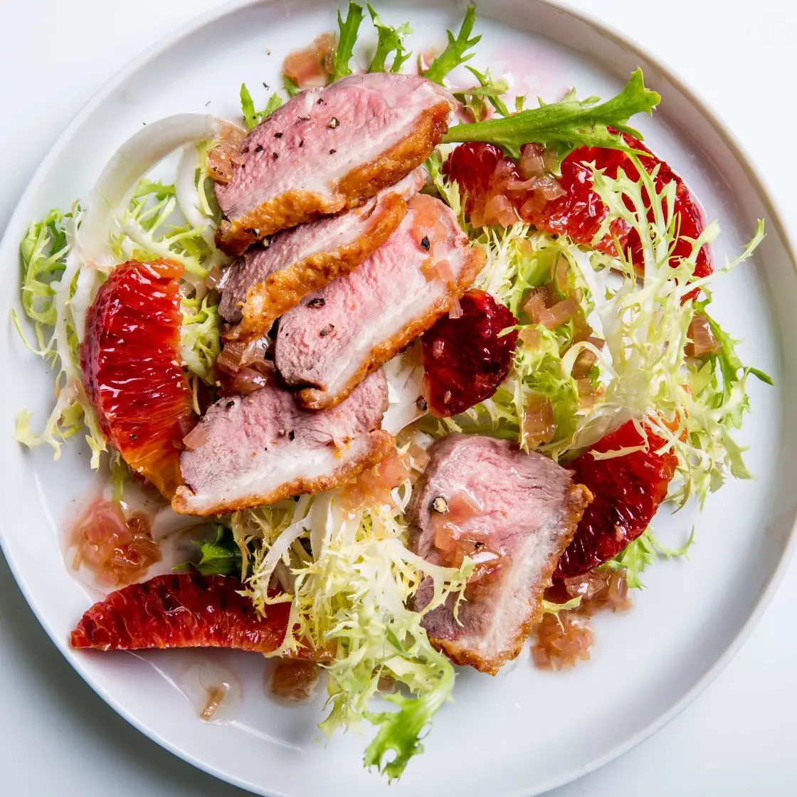 Seios de pato queixados com laranjas de sangue