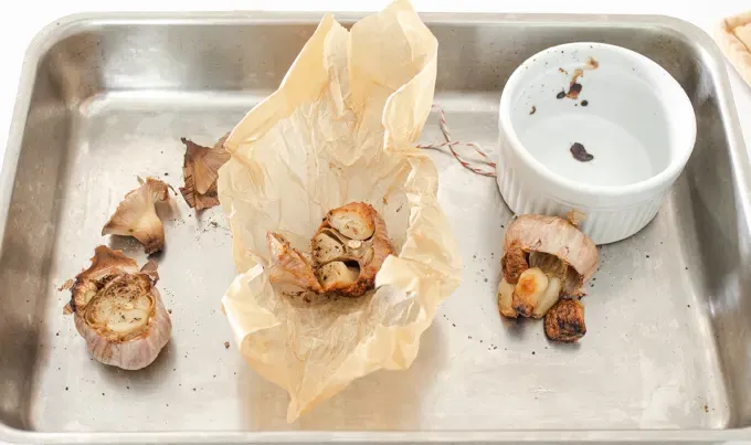 Side by side comparison of three ways to roast garlic without aluminum foil.' title='How to Roast Garlic Without Aluminum Foil