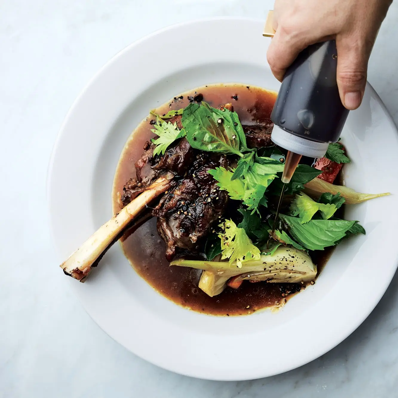 Hastes de cordeiro refogado com molho de peixe