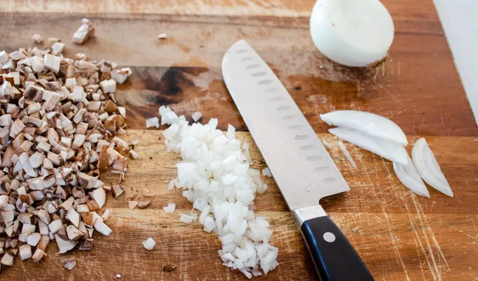 Chopping onions finely.' title='Gluten Free Cheesy Potatoes