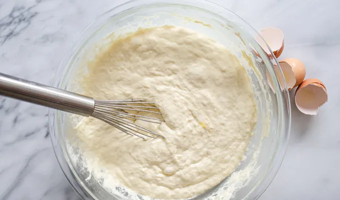 The final batter in a large bowl on a marble surface.' title='The Best Sourdough Pancakes