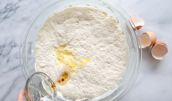 Adding the maple syrup.' title='The Best Sourdough Pancakes