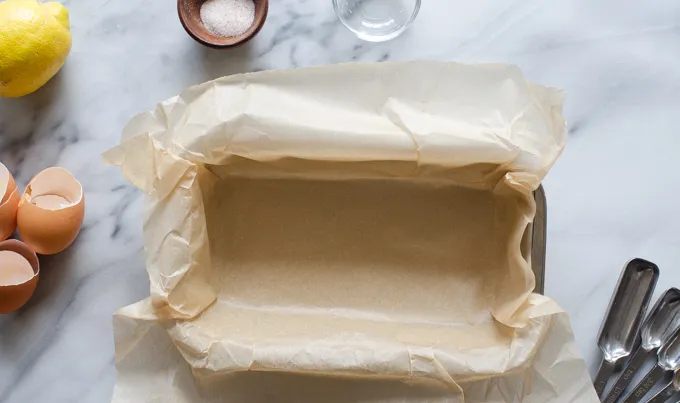 The pan lined with parchment paper.' title='Sour Cream Pound Cake Loaf