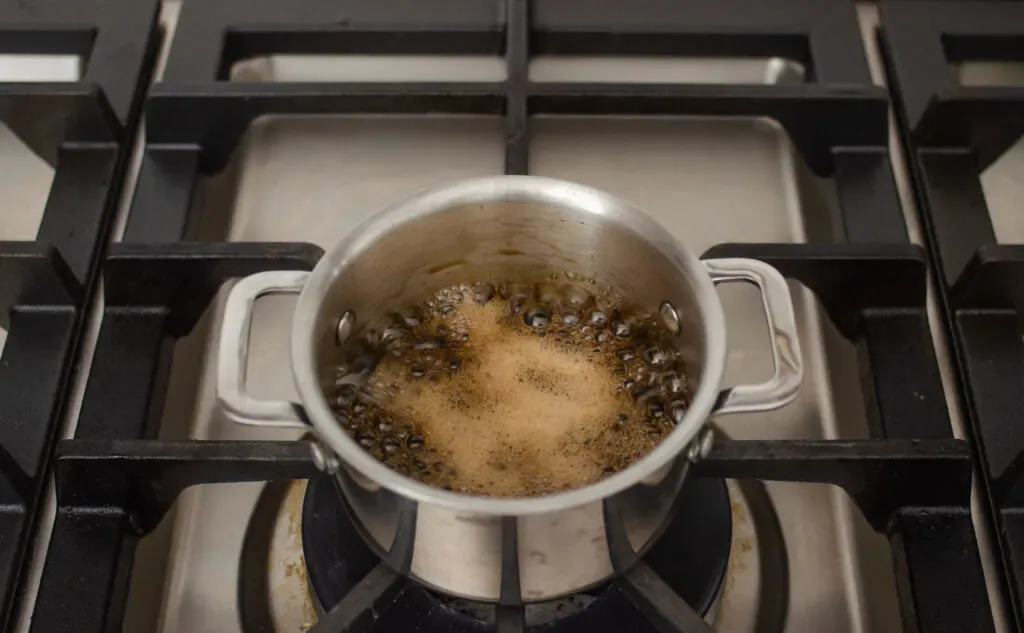 Boiling the brown sugar simple syrup.' title='How to Make Matcha Milk Tea with Boba