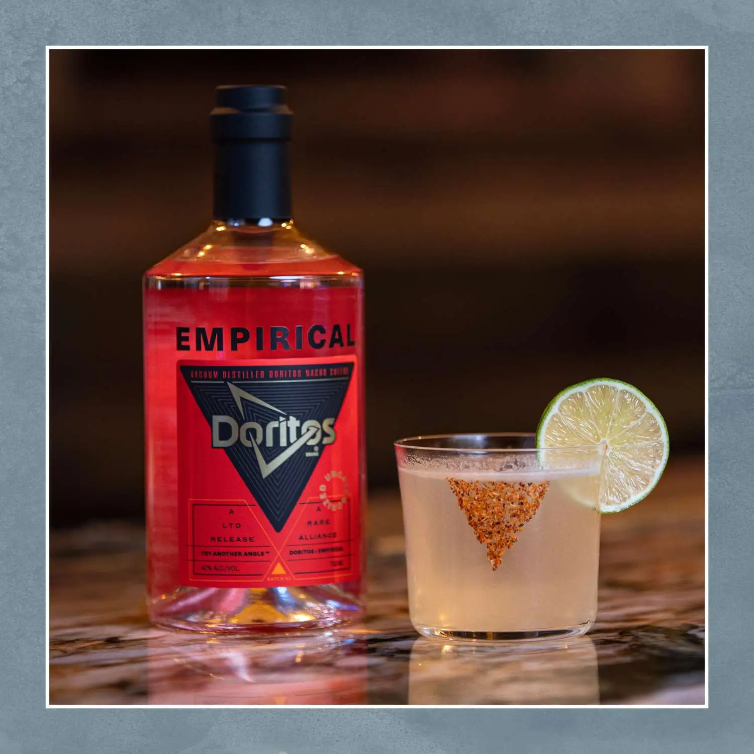 Empirical Doritos distillate pictured with Spicy Margarita riff with lime wheel and Doritos dust