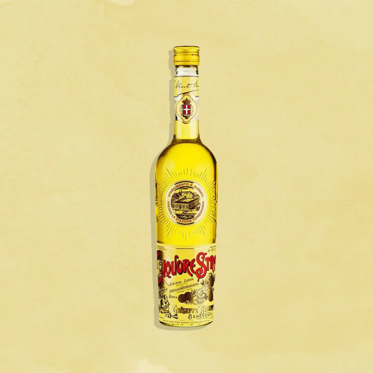 Strega bottle against a yellow background