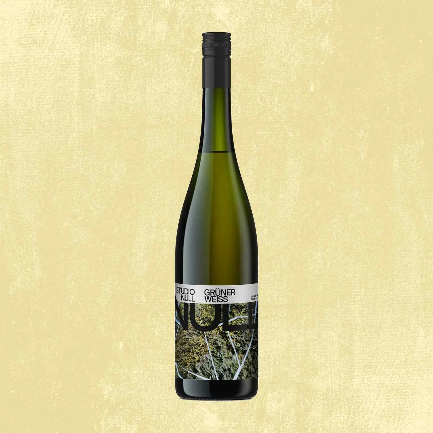 Nul Gruner Weiss non alcoholic wine bottle against tan background