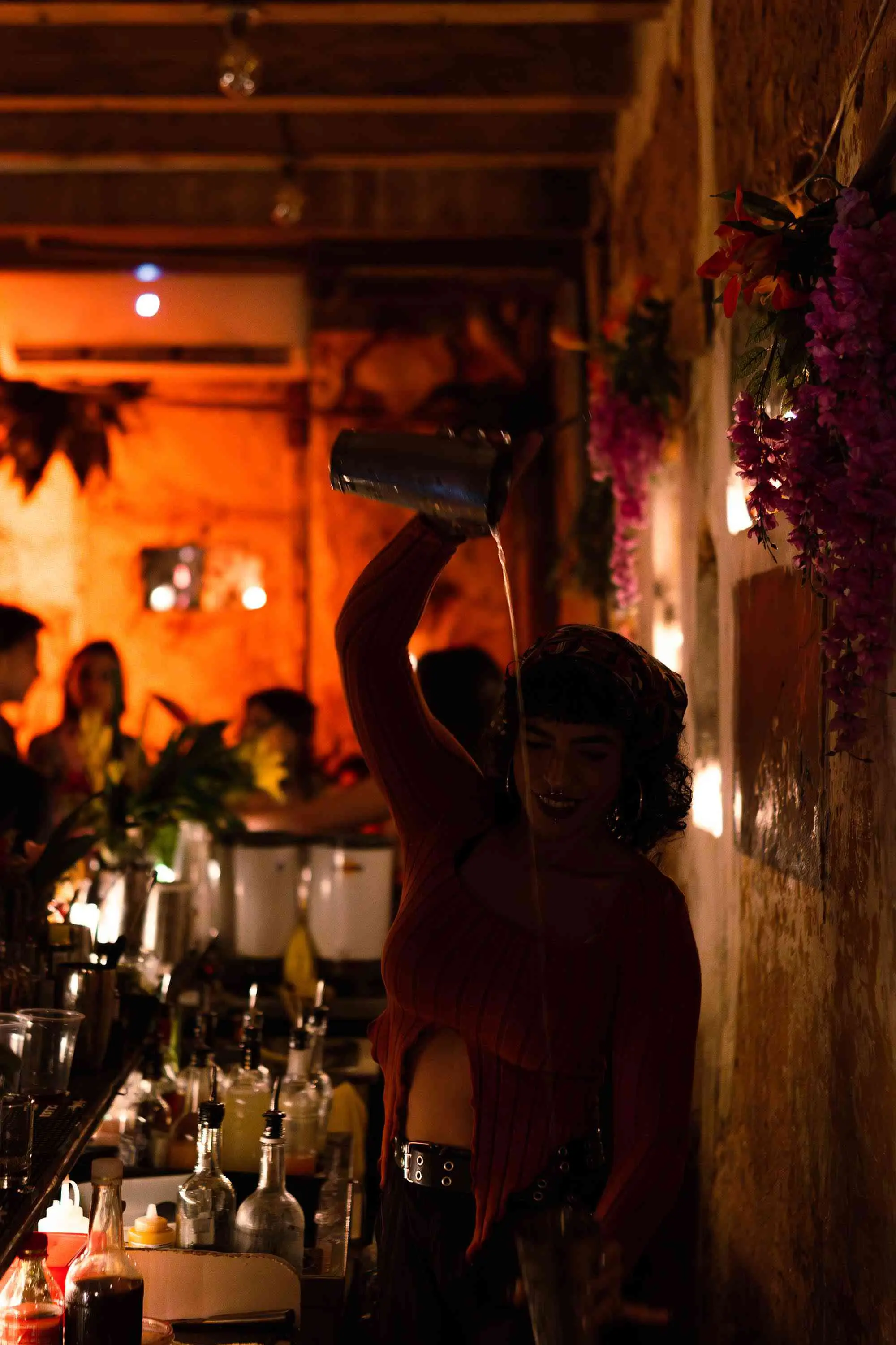 Bartender pouring a drink at La Factoria