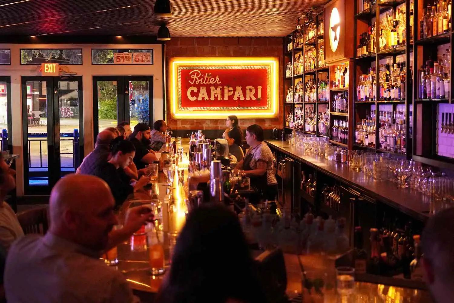 Interior of Anvil with Bitter Campari sign lit up in background