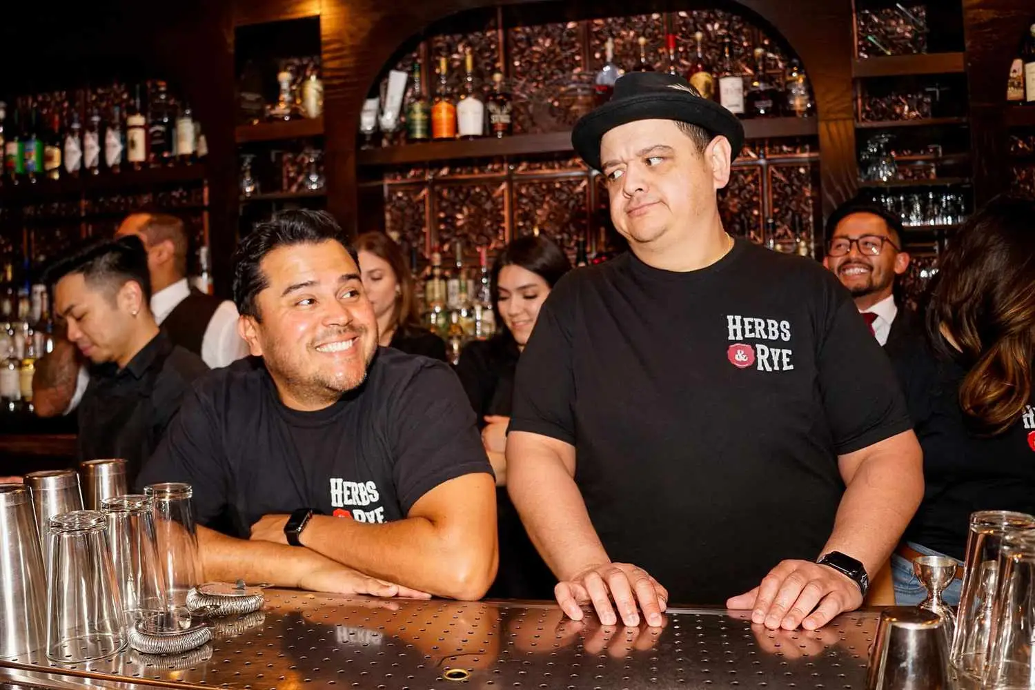 Two men standing at bar at Herbs & Rye