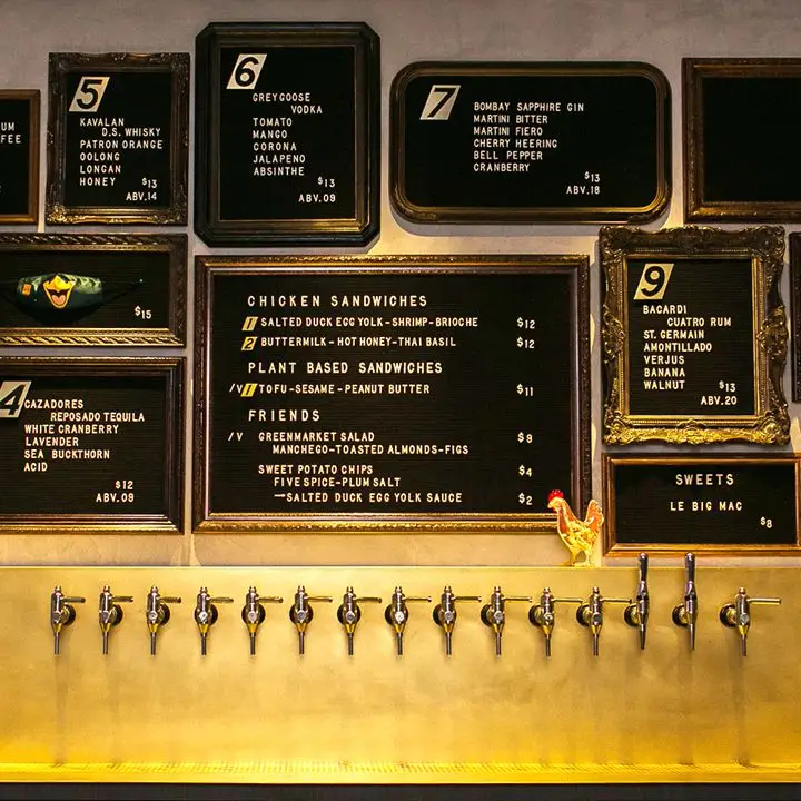 The menu posted on the wall at Double Chicken Please in New York City includes the ABV of each cocktail.