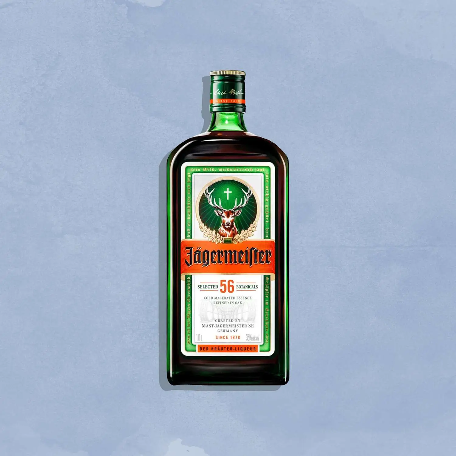 Bottle of Jagermeister against blue background