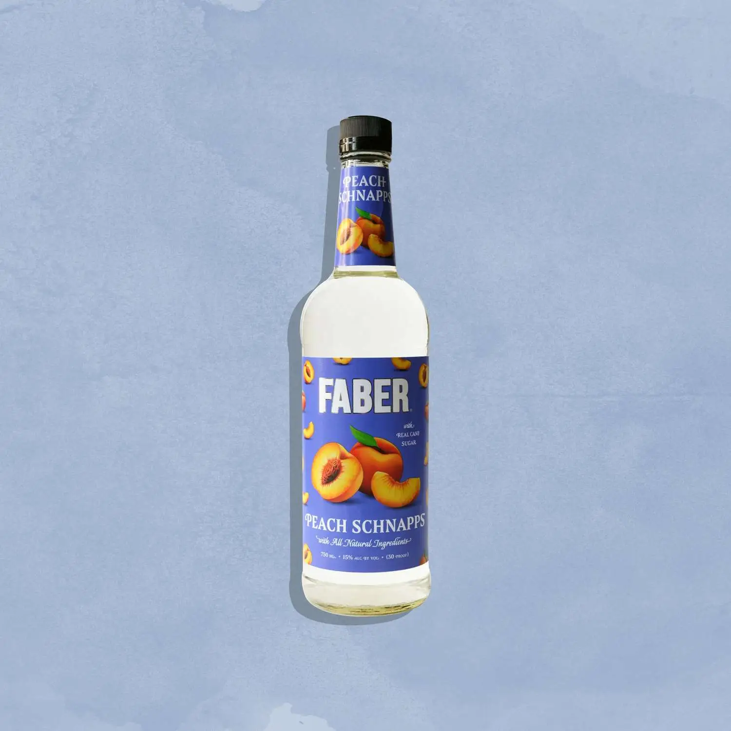 Faber peach schnapps bottle against blue background