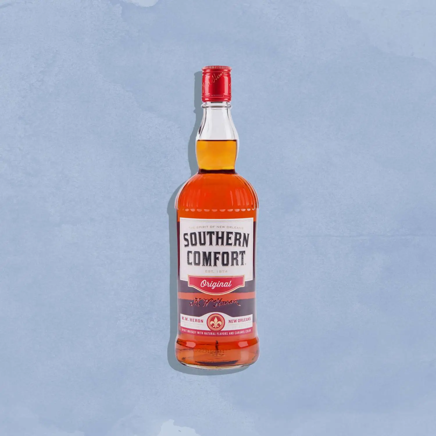 Southern Comfort bottle against blue background