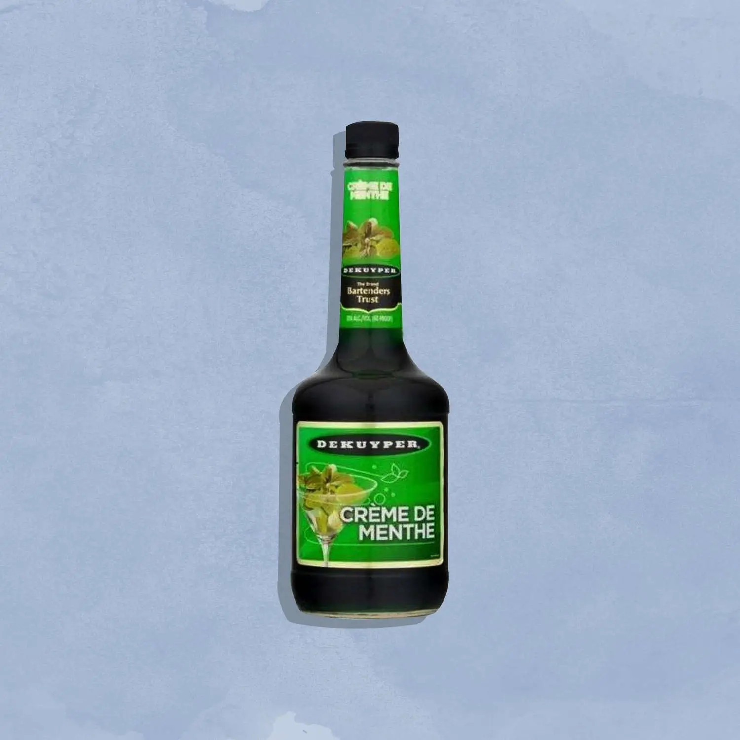 Creme de menthe bottle against blue background