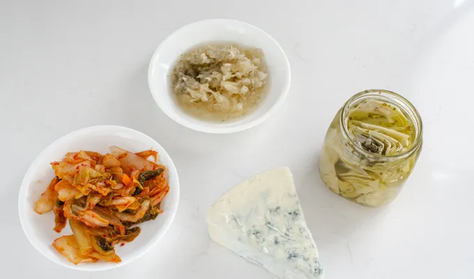 Funky snacks: kimchi sauerkraut artichokes and blue cheese.' title='Easy Snack Board Ideas