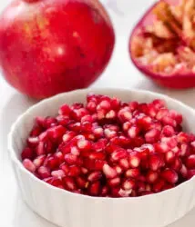 Pomegranate arils in a white ramekin.' title='How to Remove Seeds from a Pomegranate