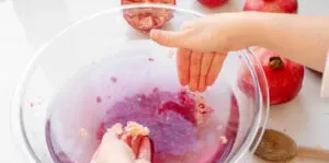 Romoving the white membranes from the the bowl of water.' title='How to Remove Seeds from a Pomegranate