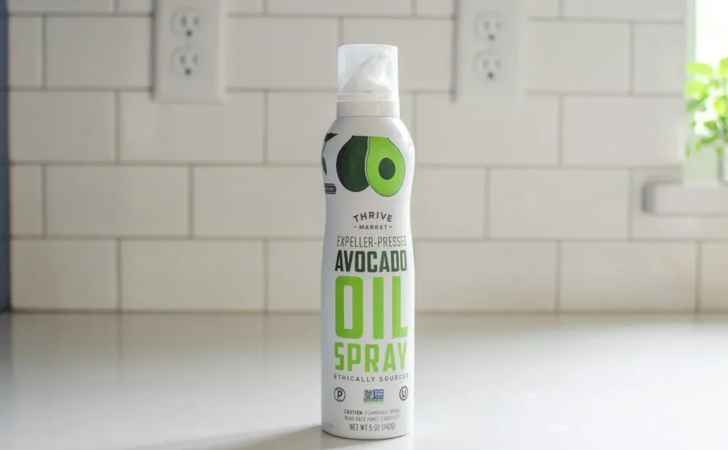 A can of avocado oil spray to be used in place of parchment paper to grease a pan for baking.' title='Parchment Paper Substitute for Baking