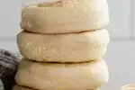A stack of fresh Sourdough English Muffins.' title='Sourdough English Muffins