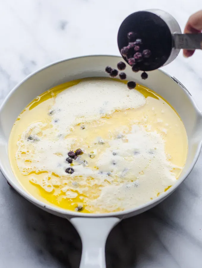Adding the blueberries.' title='Sourdough Dutch Baby/German Pancake