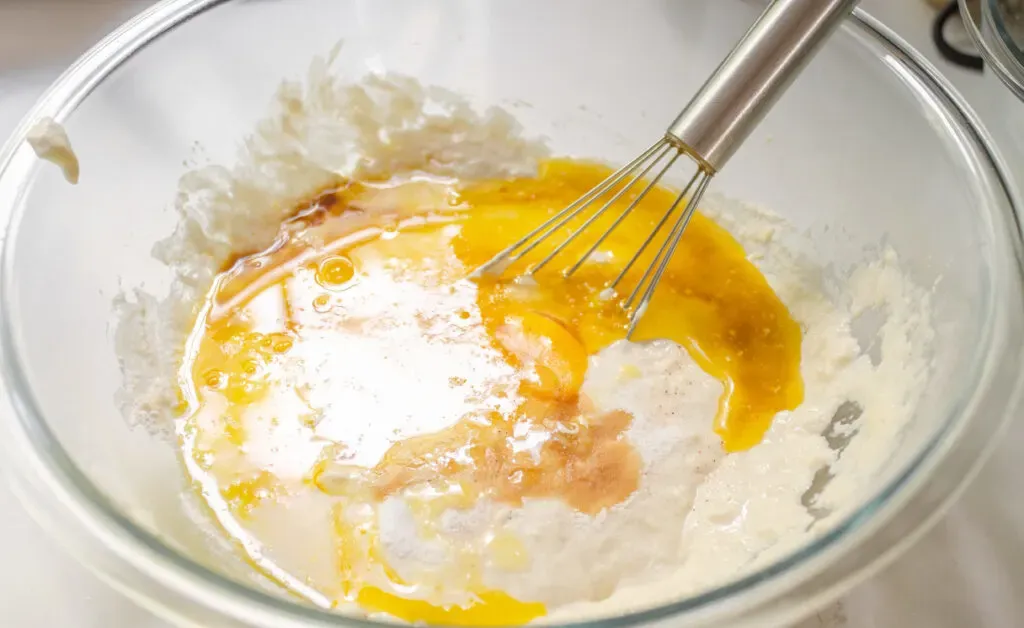 Mixing together the sourdough waffle batter.' title='Sourdough Discard Waffles Recipe