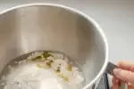 Placing all of the dough ingredients in the bowl of a stand mixer.' title='Sourdough Pizza Crust Recipe