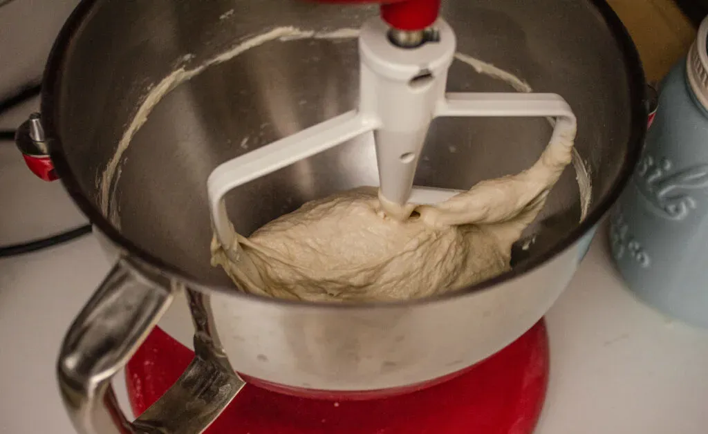 Kneading the sourdough pizza dough in a stand mixer. ' title='Sourdough Pizza Crust Recipe