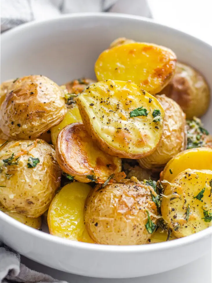 Elevated Roasted Little Potato recipe with fresh herbs lemon garlic and parmesan cheese.' title='Roasted Little Potato Recipe