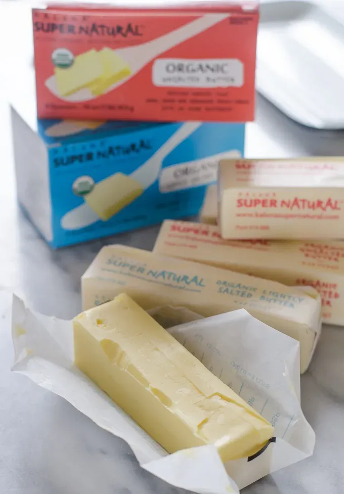 Opened stick of butter on a marble surface.' title='Ingredient Spotlight: Kalona SuperNatural Butter