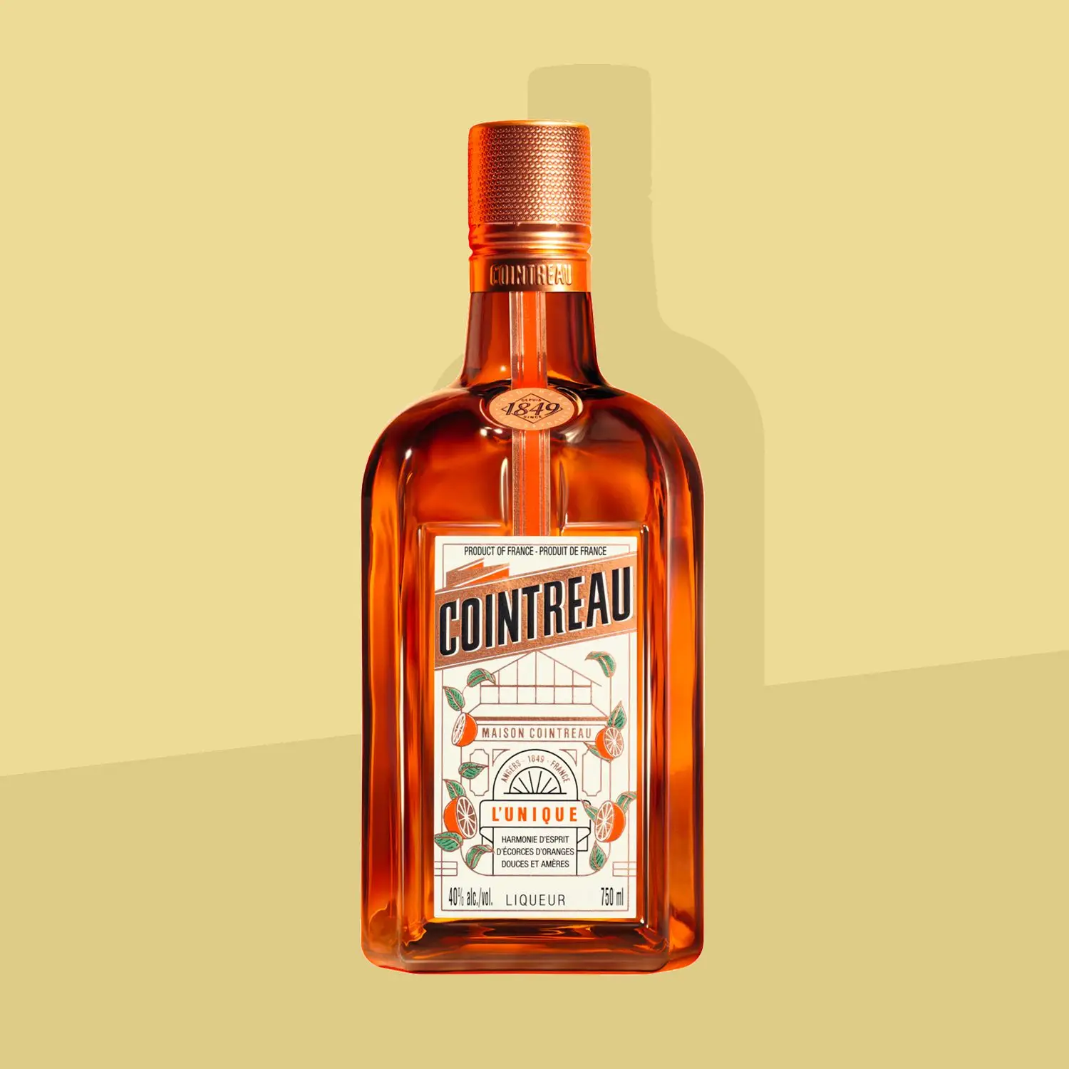 Bottle of Cointreau solo on a yellow background
